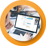 someone looking at their laptop with the laptop screen being the main focus